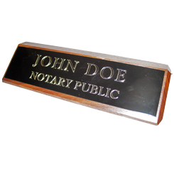 This elegant, genuine Florida notary walnut desk, sign is made of solid wood and engraved on a metal plate with gold lettering with your notary name and the wording 'Notary Public'. It makes a fine addition to any desk or office. This sign can be customized with up to two lines.